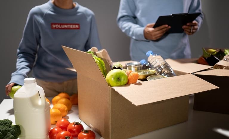 Volunteers sort through food donations